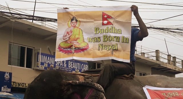 हात्तीमा स्टीकर टाँस्दै भनियो ‘बुद्ध वाज बर्न इन नेपाल’